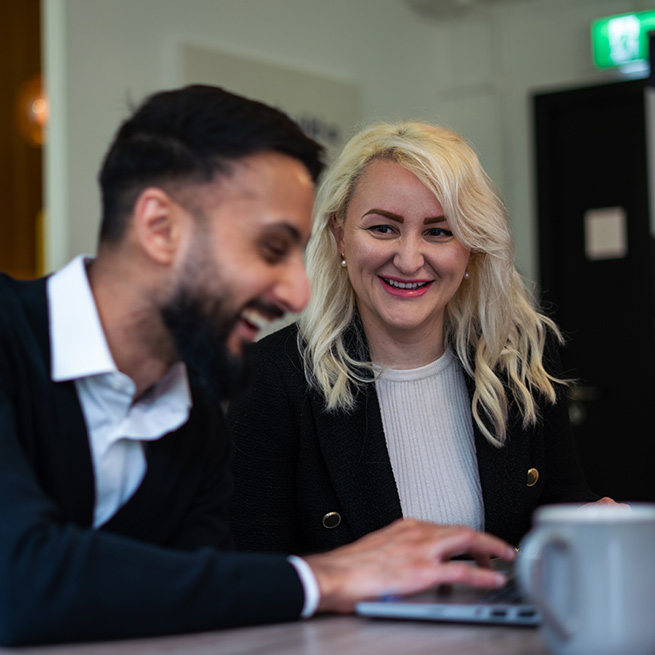 Interviews at Shaw Trust – A man and a woman seated at a desk having a conversation