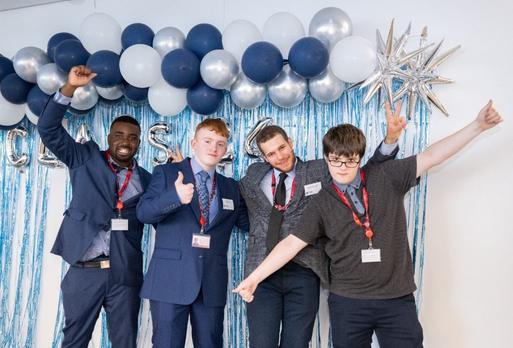 Group photo of our four male participants and the Supported Internship graduation.