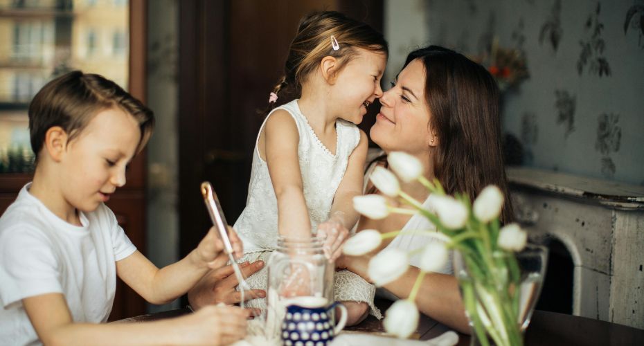 Woman holding child smiling