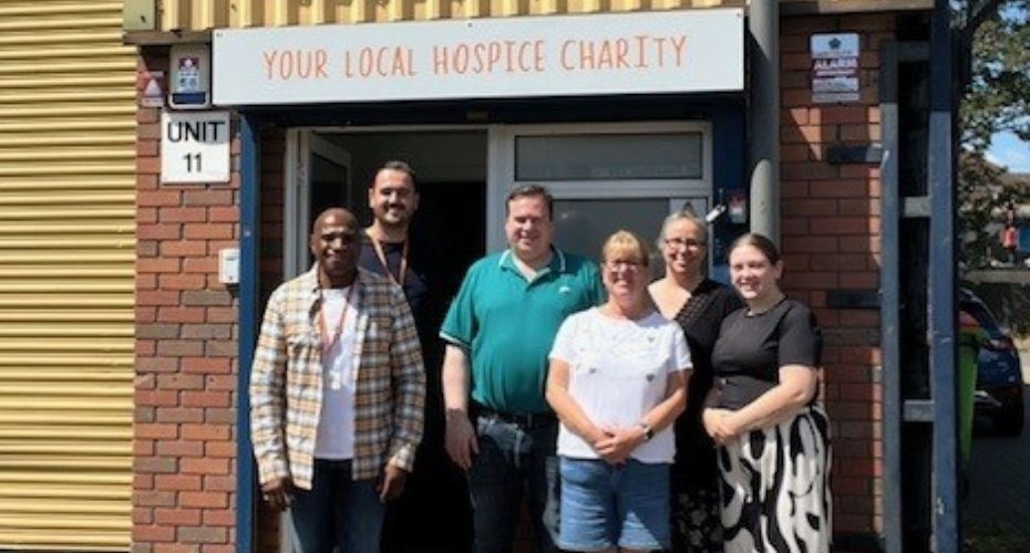 Group standing outside Ellenor Charity building