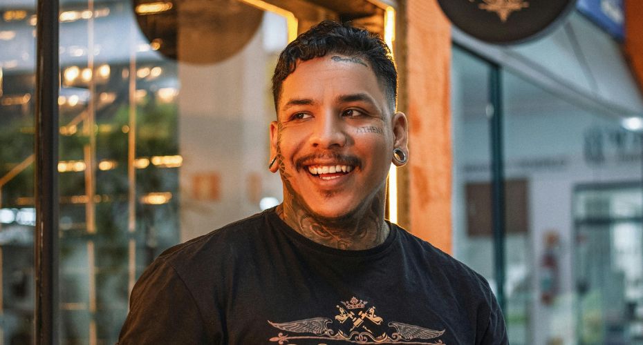 All Wales manual handling passport Man smiling wearing piercings