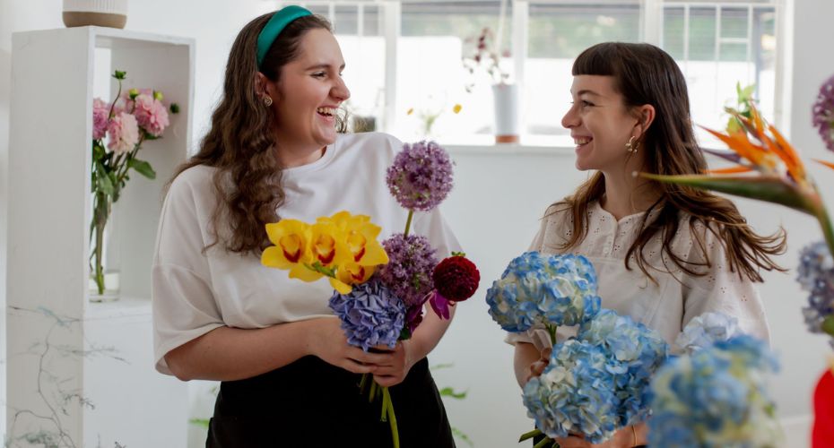 Two people in a flower shop