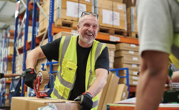 Man in hi-viz in warehouse
