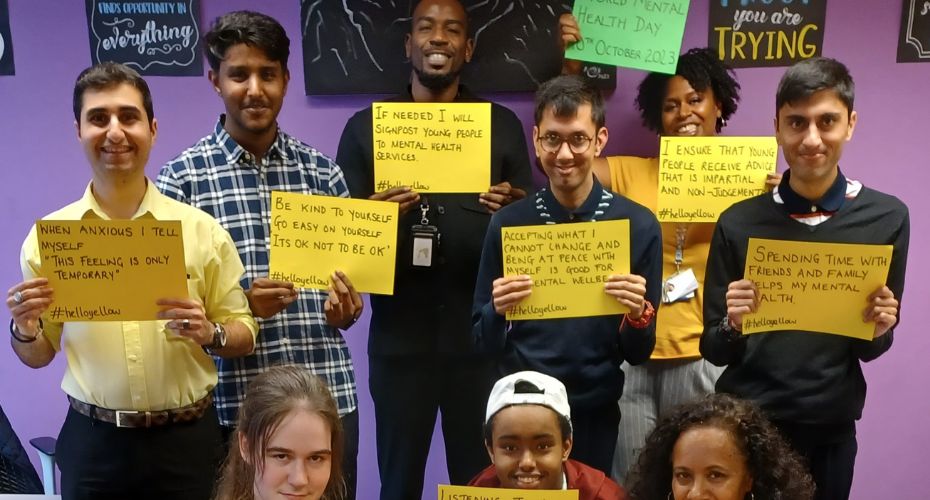 A group of people holding signs