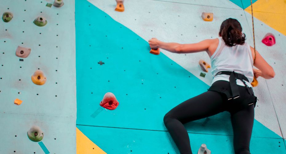 Person climbing wall